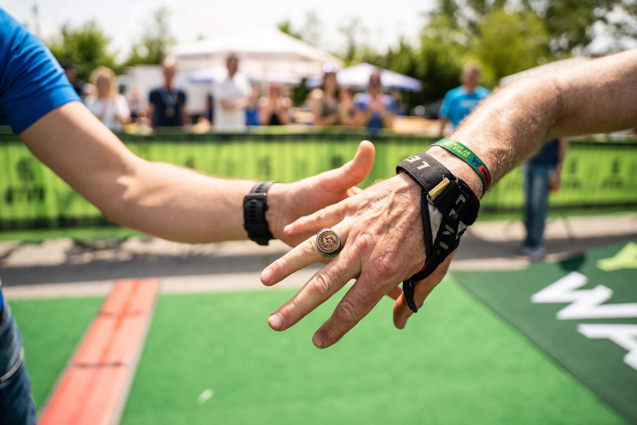 Finishers of the 160km race receive the UTVV Emperor ring at the finish line