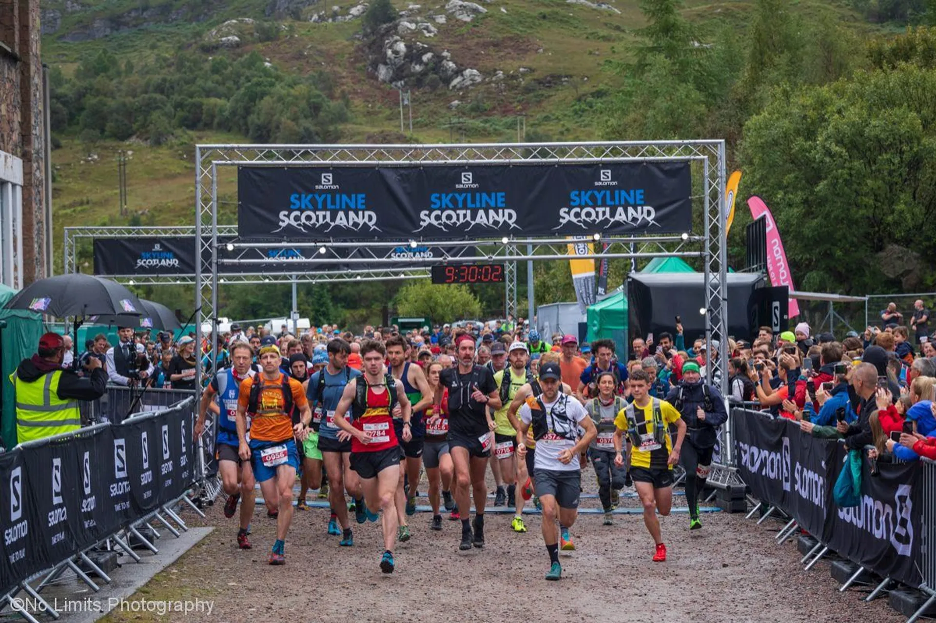 The image shows a running event called "Skyline Scotland." Runners have just