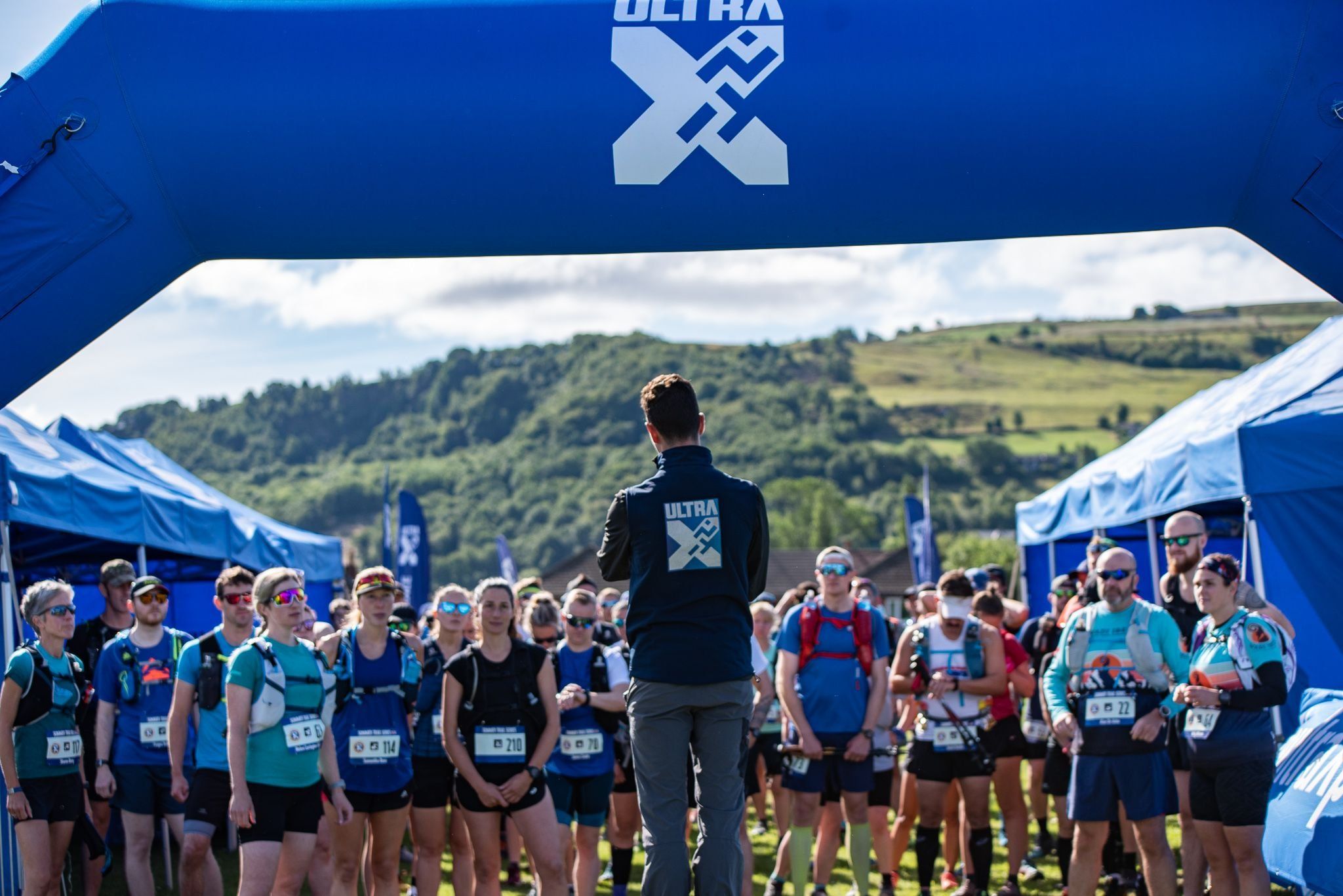 Sam briefing runners on the start-line ahead of a 2022 Ultra X race