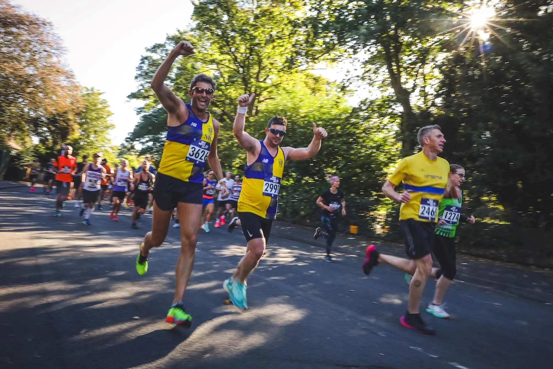 The image depicts a group of people participating in a running event, most likely a