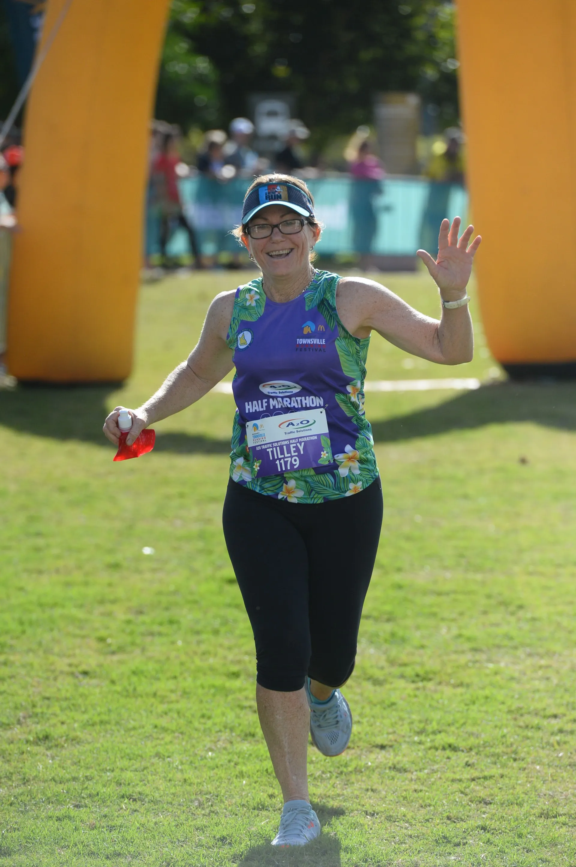 In the image, you see a woman participating in a running event, possibly a