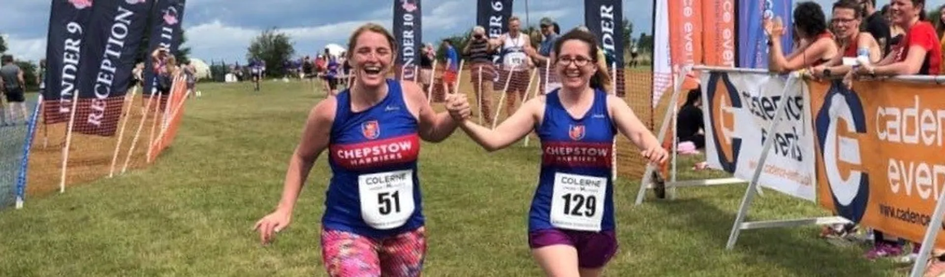 The image shows two individuals who appear to be participating in a running event. They