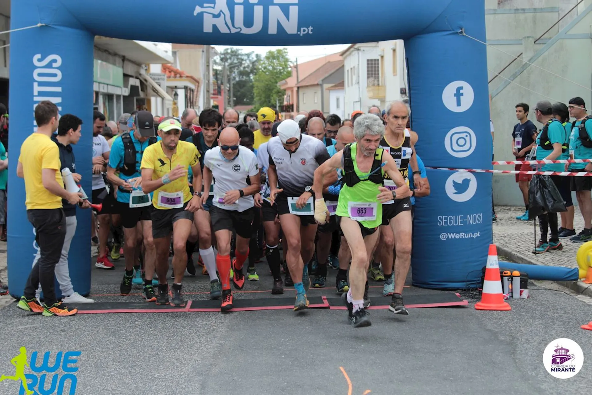 In the image, we see a group of runners at the starting line of a