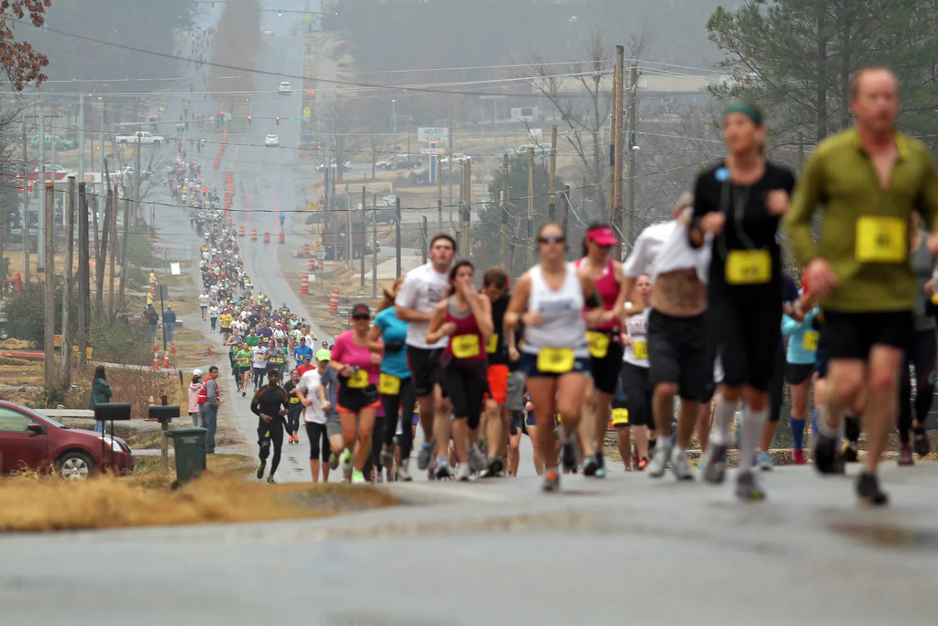 In this image, we see a group of people participating in a road race.