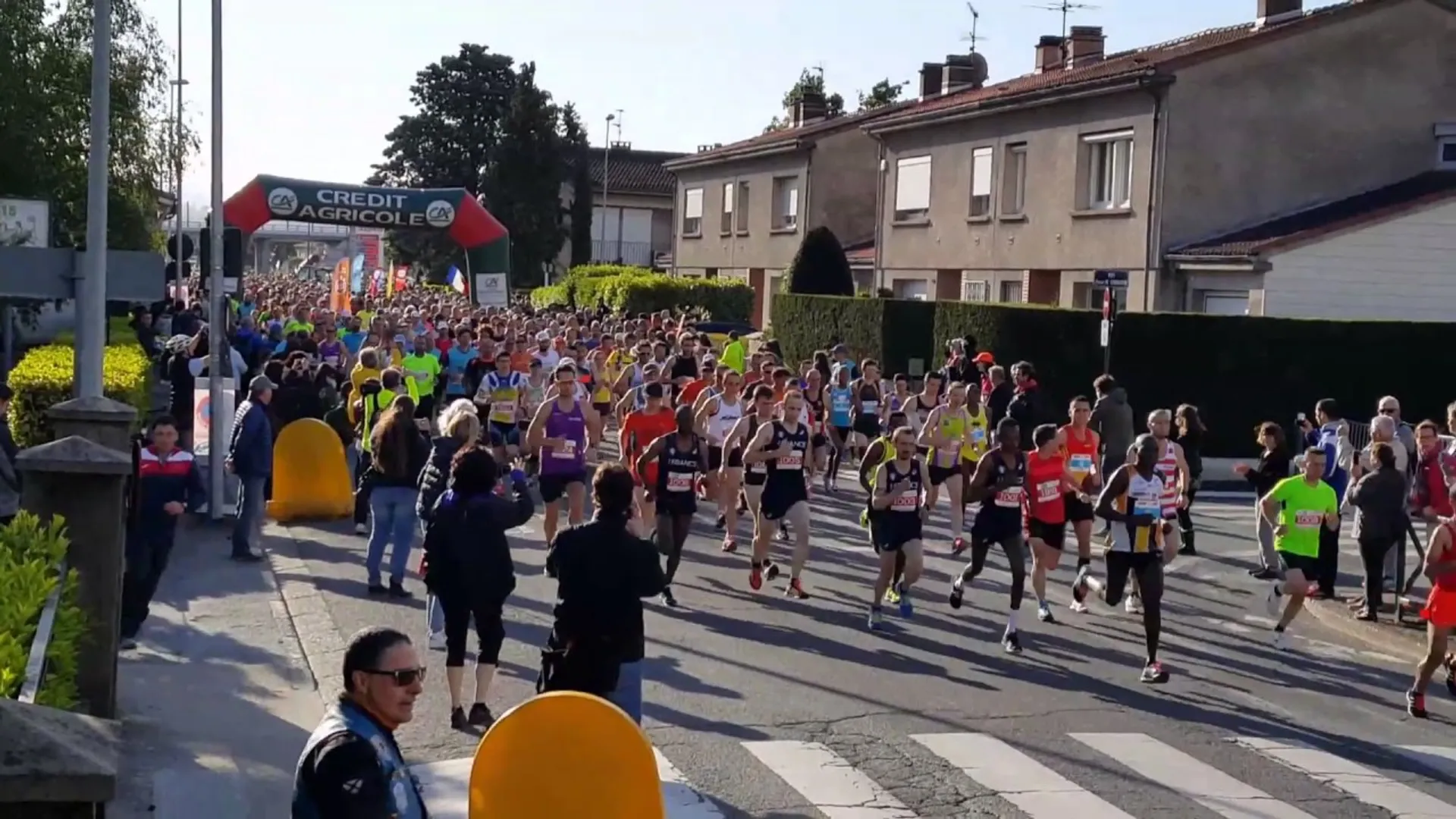 This image features a running event, possibly a marathon or a race, with a