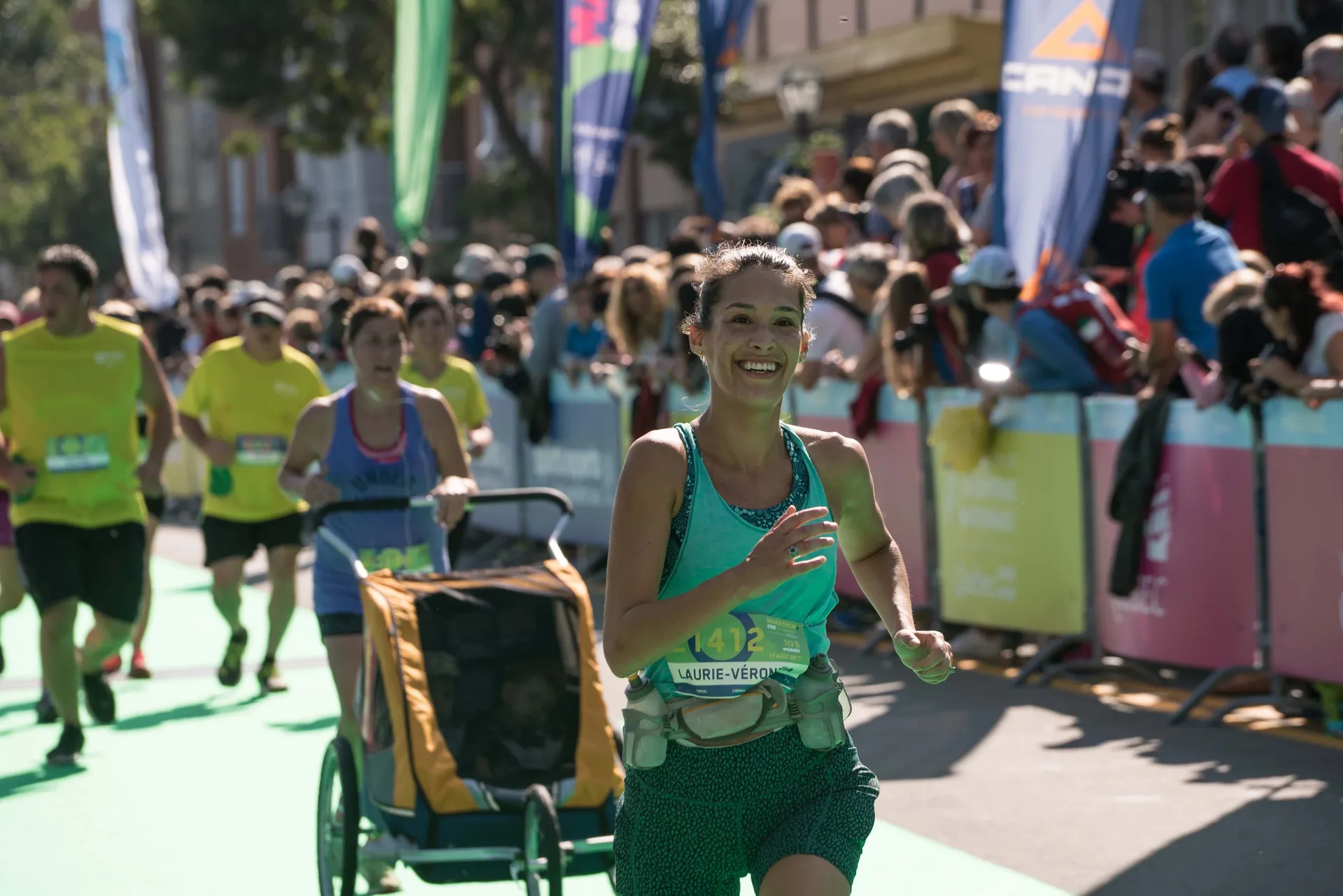 The image depicts a runner, a woman, who is participating in a race while