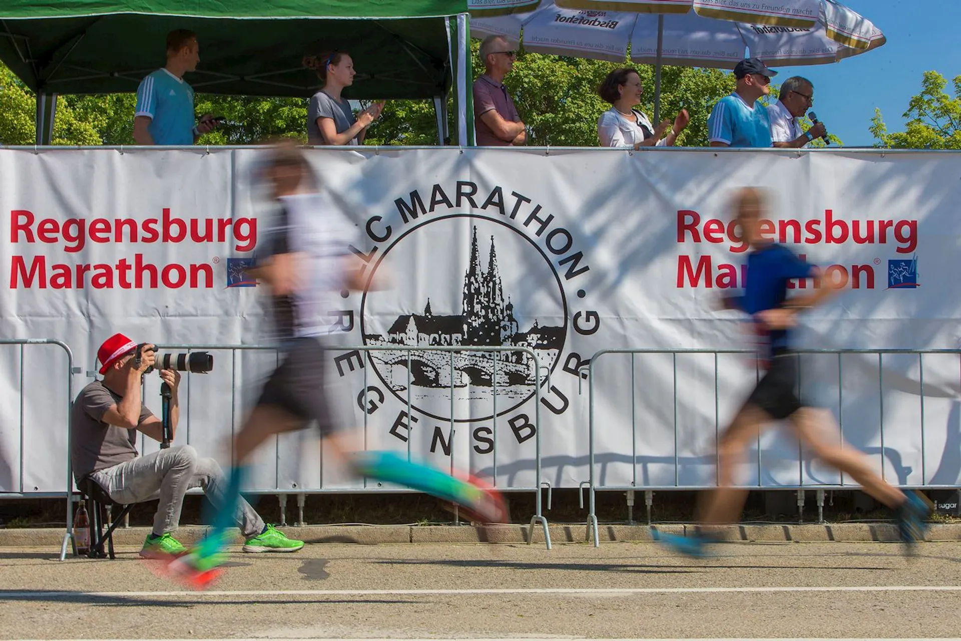 The image shows a scene from a marathon event, specifically the Regensburg Marathon,