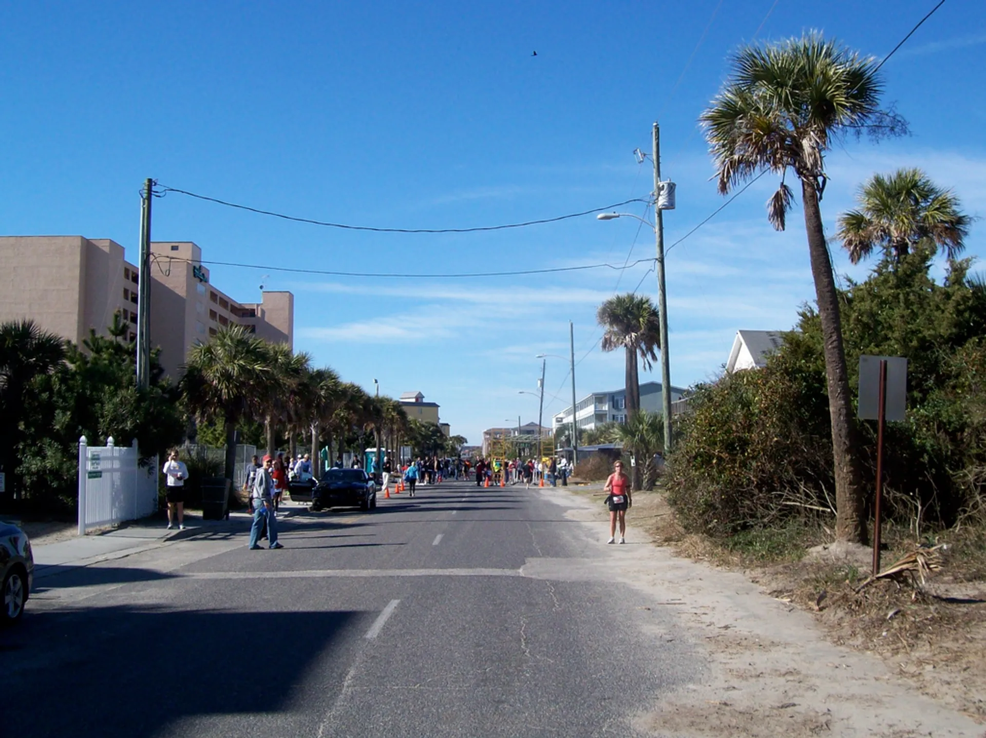The image shows a street scene likely in a coastal area, judging by the presence