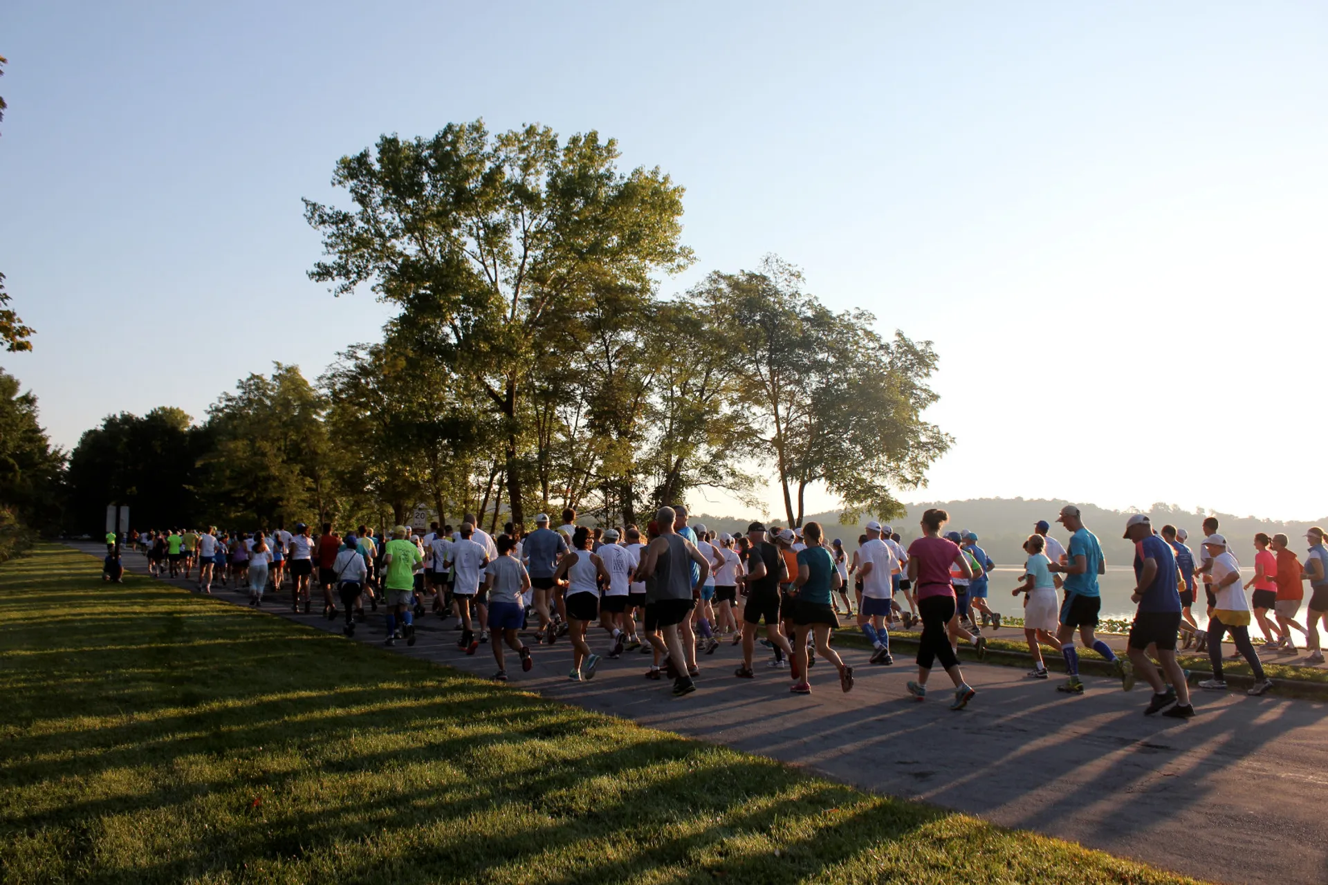 The image shows a group of people participating in a running event, possibly a race