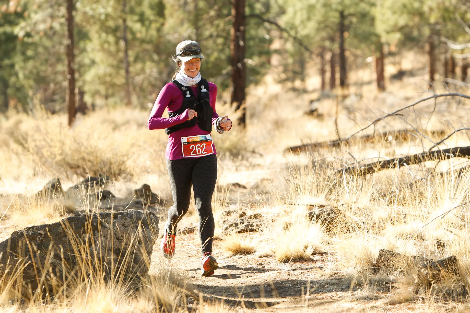The image shows a person jogging or running outdoors in what appears to be a trail