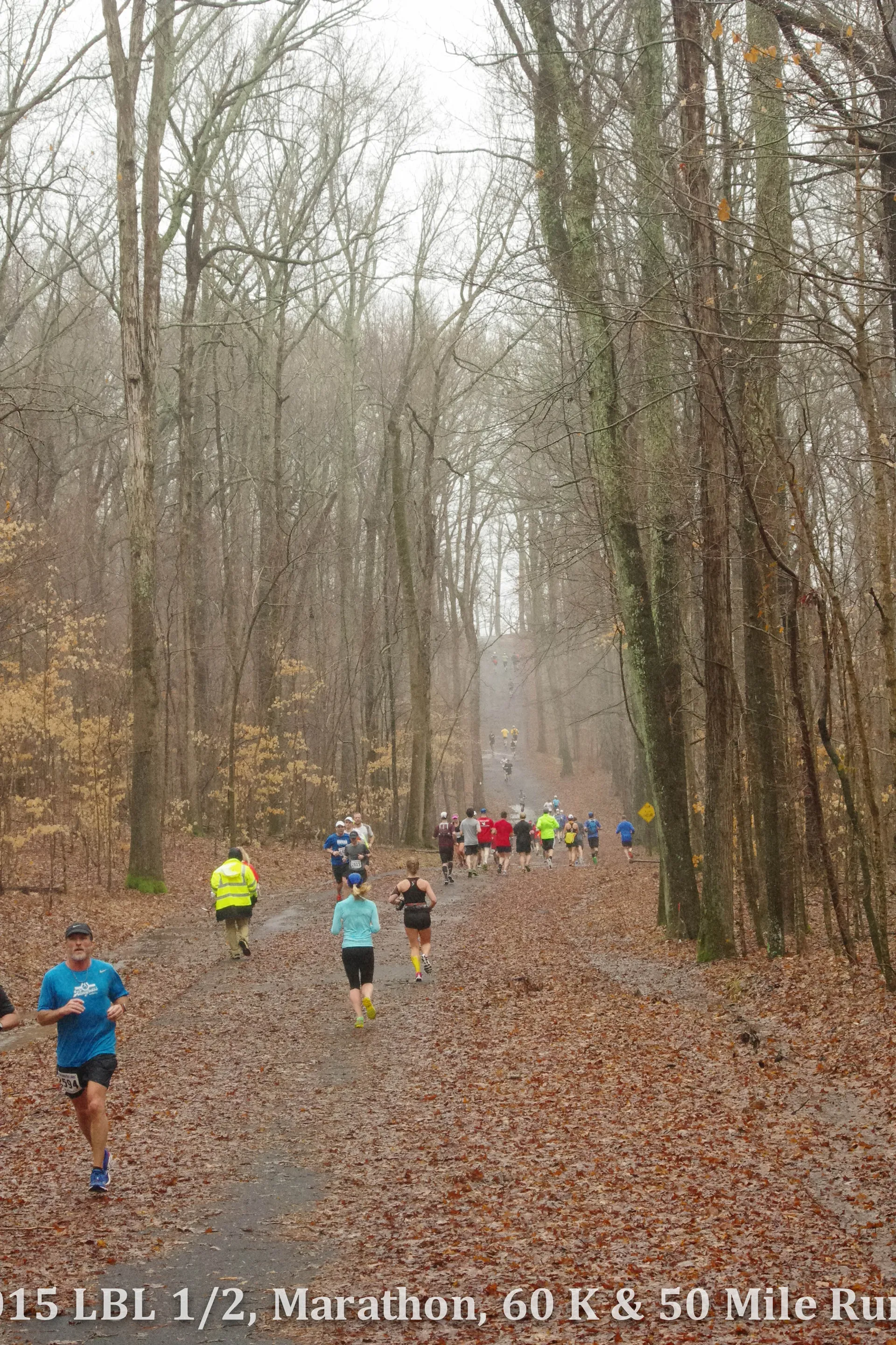 The image shows a group of runners participating in an outdoor running event. They are