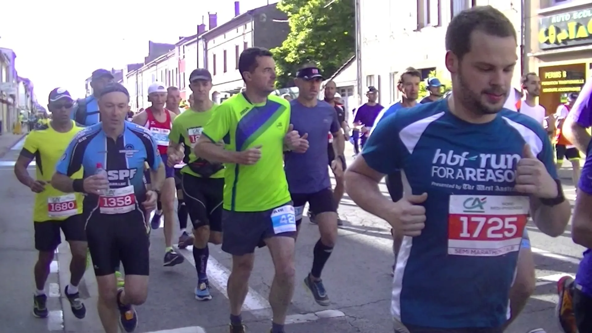 The image shows a group of people participating in a running event. They appear to