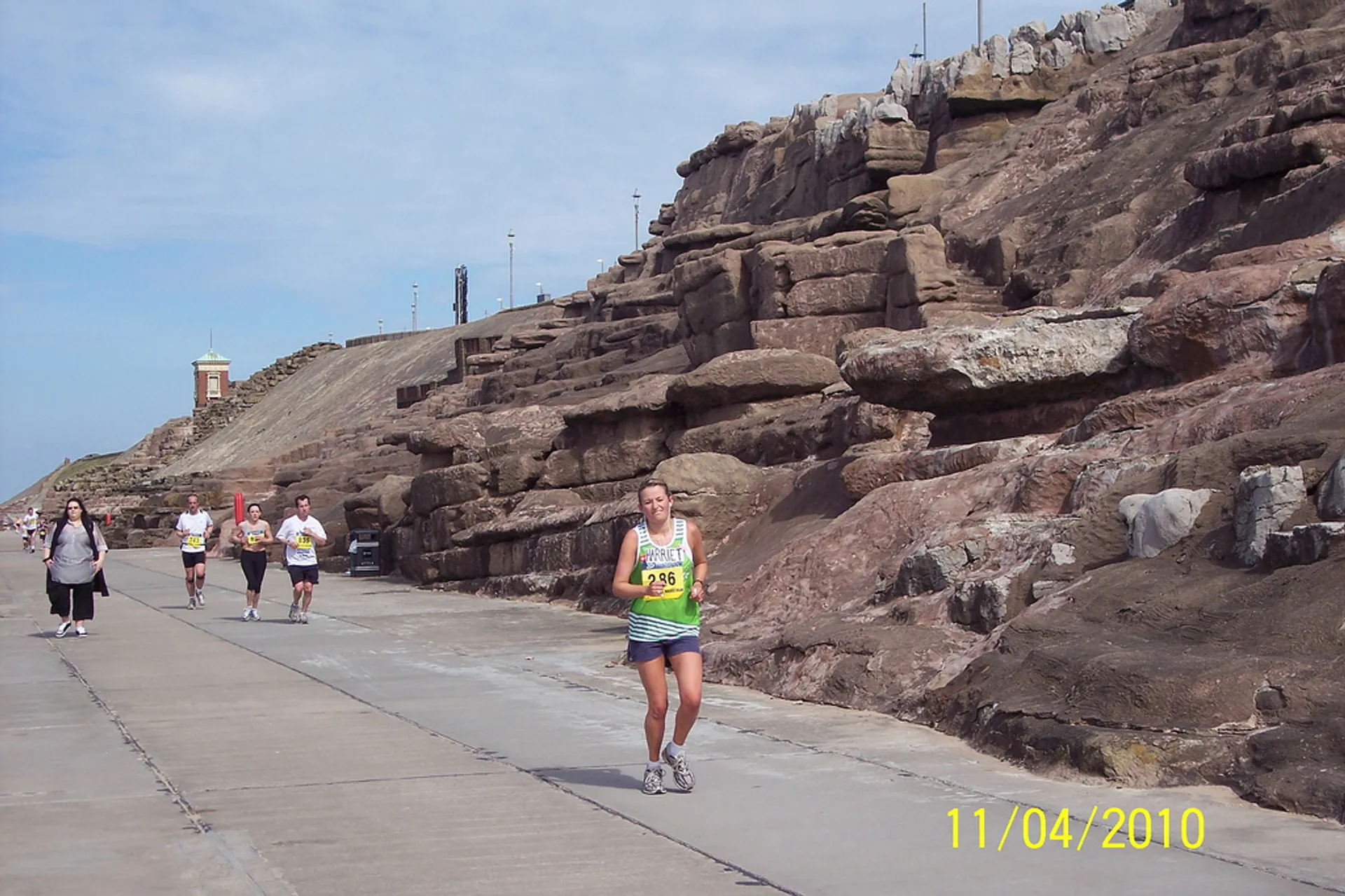 This image shows a group of people participating in a running event. The focus is