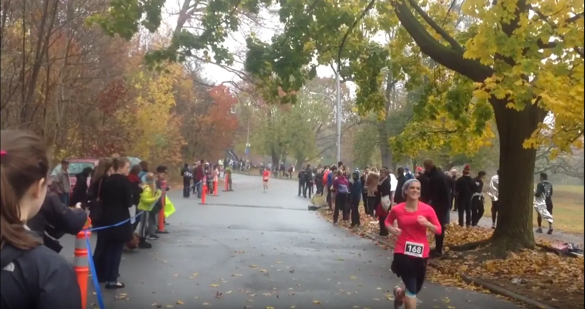 The image shows a running event, possibly a race or a marathon, in a