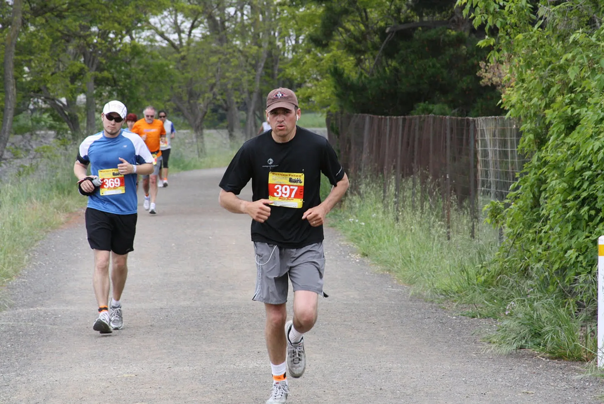 In this image, there is a group of people participating in a running event,