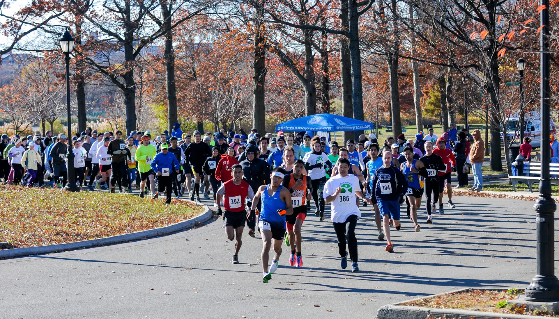 In the image, you can see a group of people participating in a running event