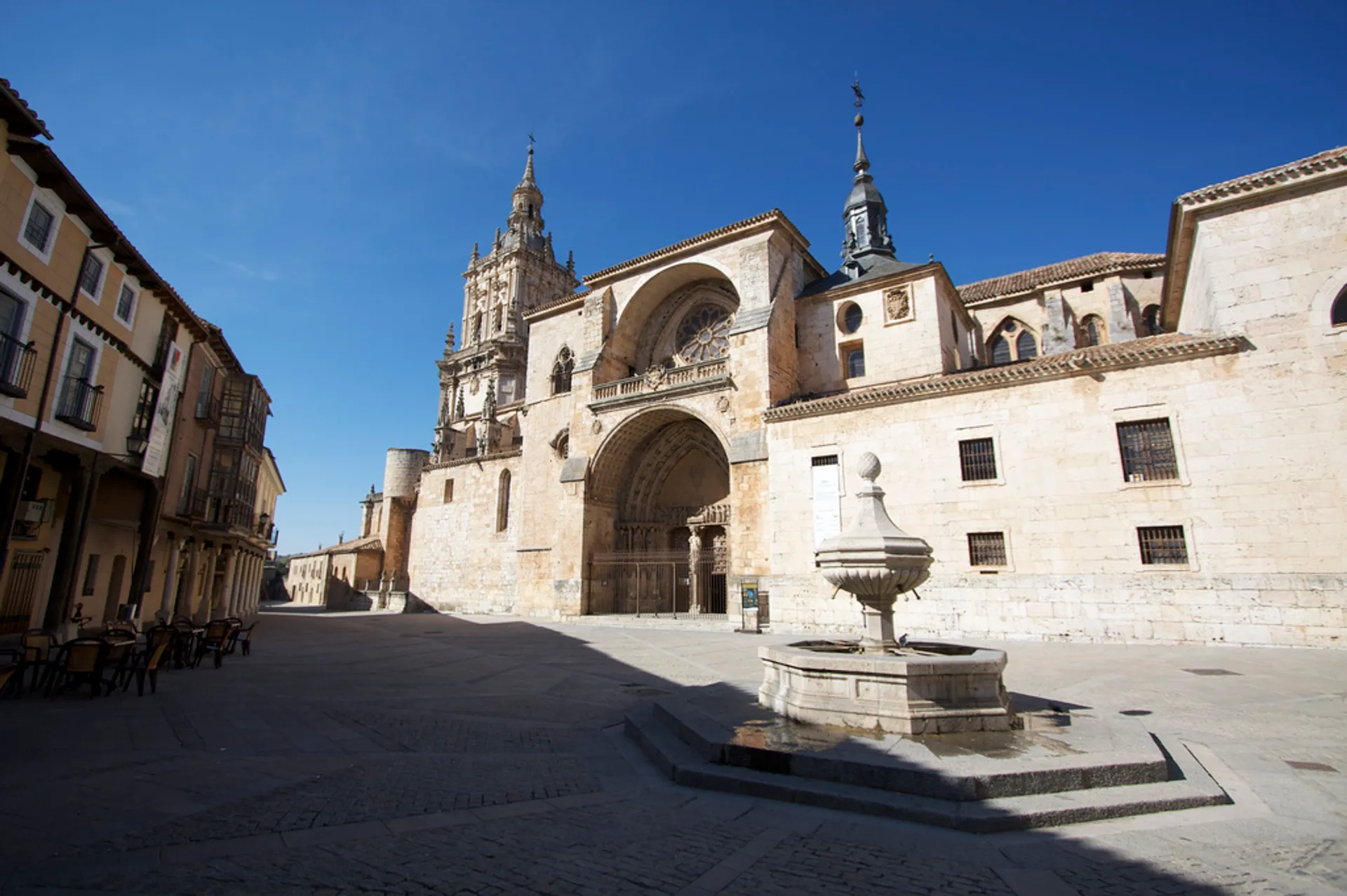 The image features a large, ornate cathedral with Gothic architectural elements. The cathedral