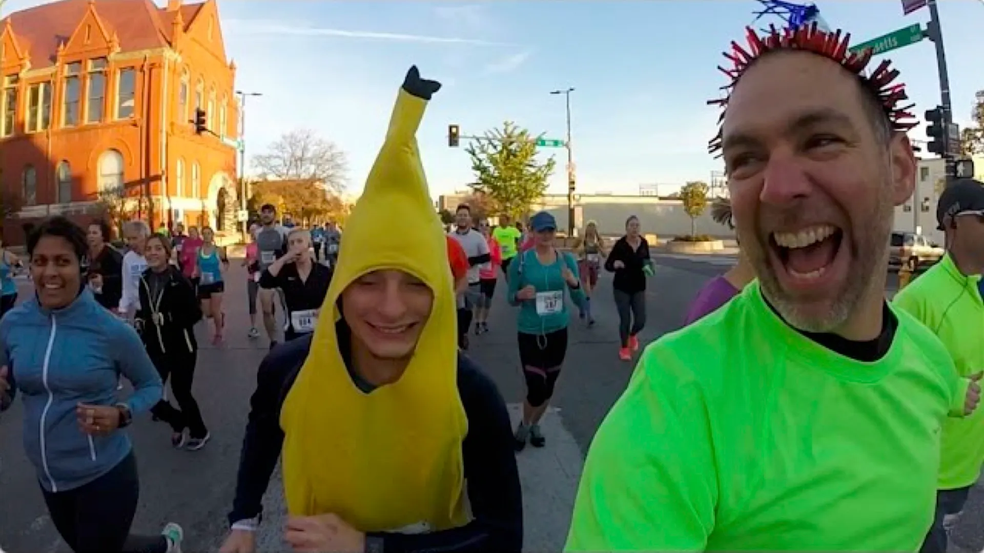 The image shows a group of people participating in what appears to be a public running