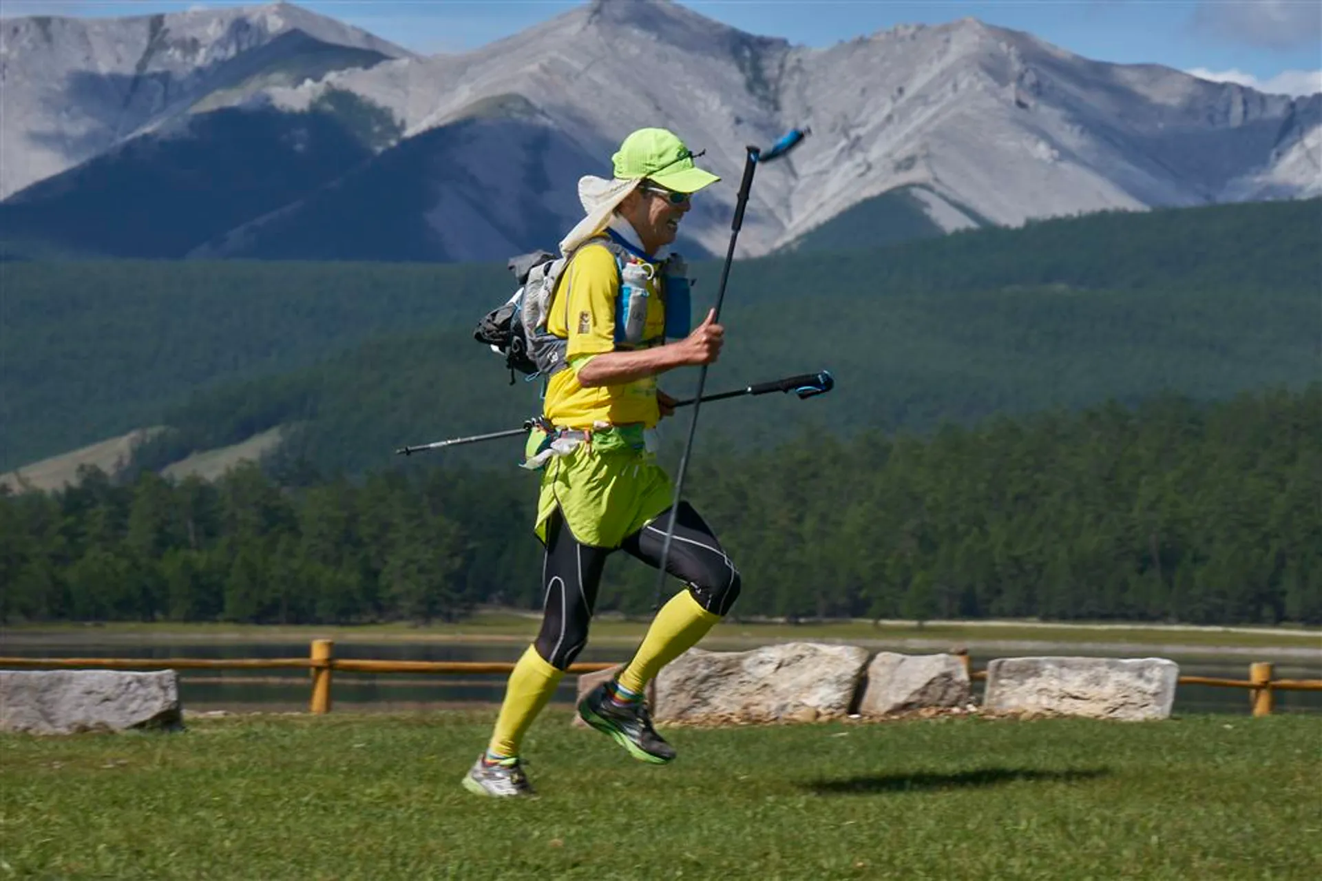 The image depicts a person engaged in an outdoor activity, likely trail running or a