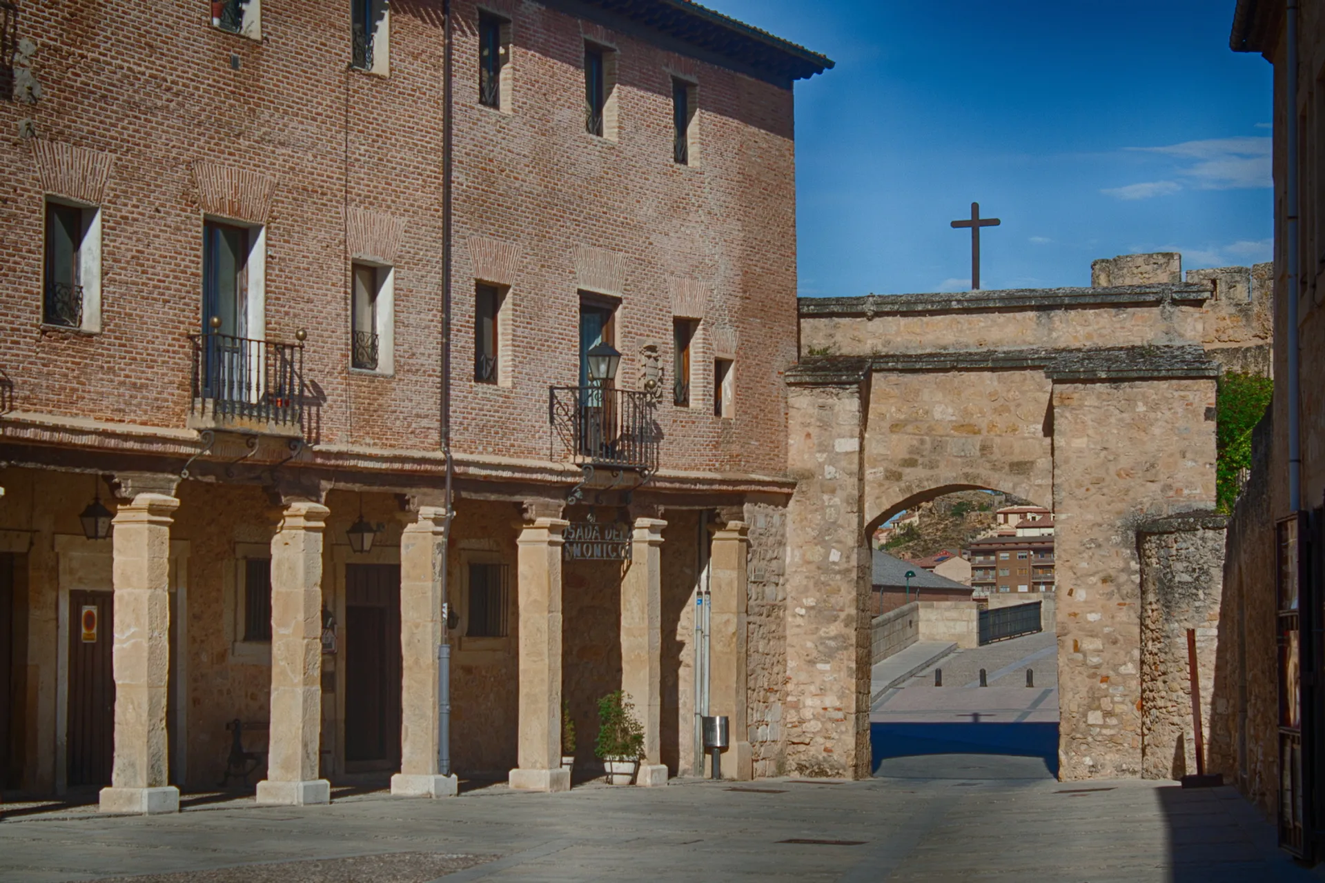 The image shows a scene of an old, historic town. There is a classic