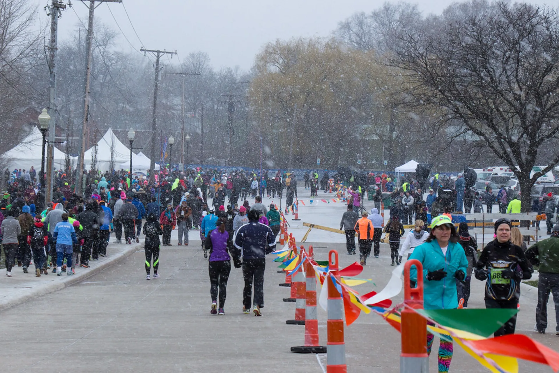 This image depicts an outdoor event where a number of people are gathering, presumably for