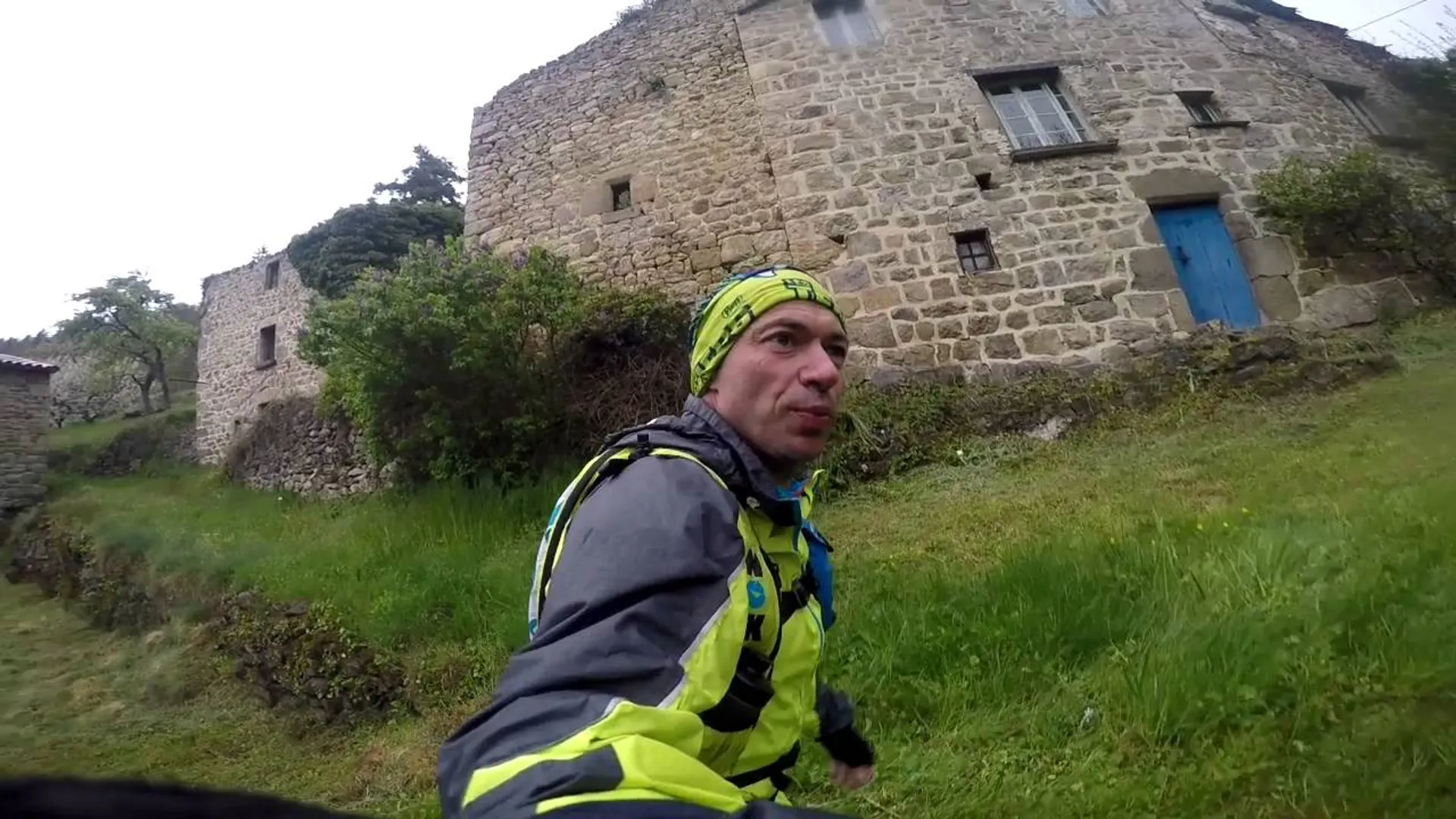 The image shows a person wearing a headband, a jacket, and what appears