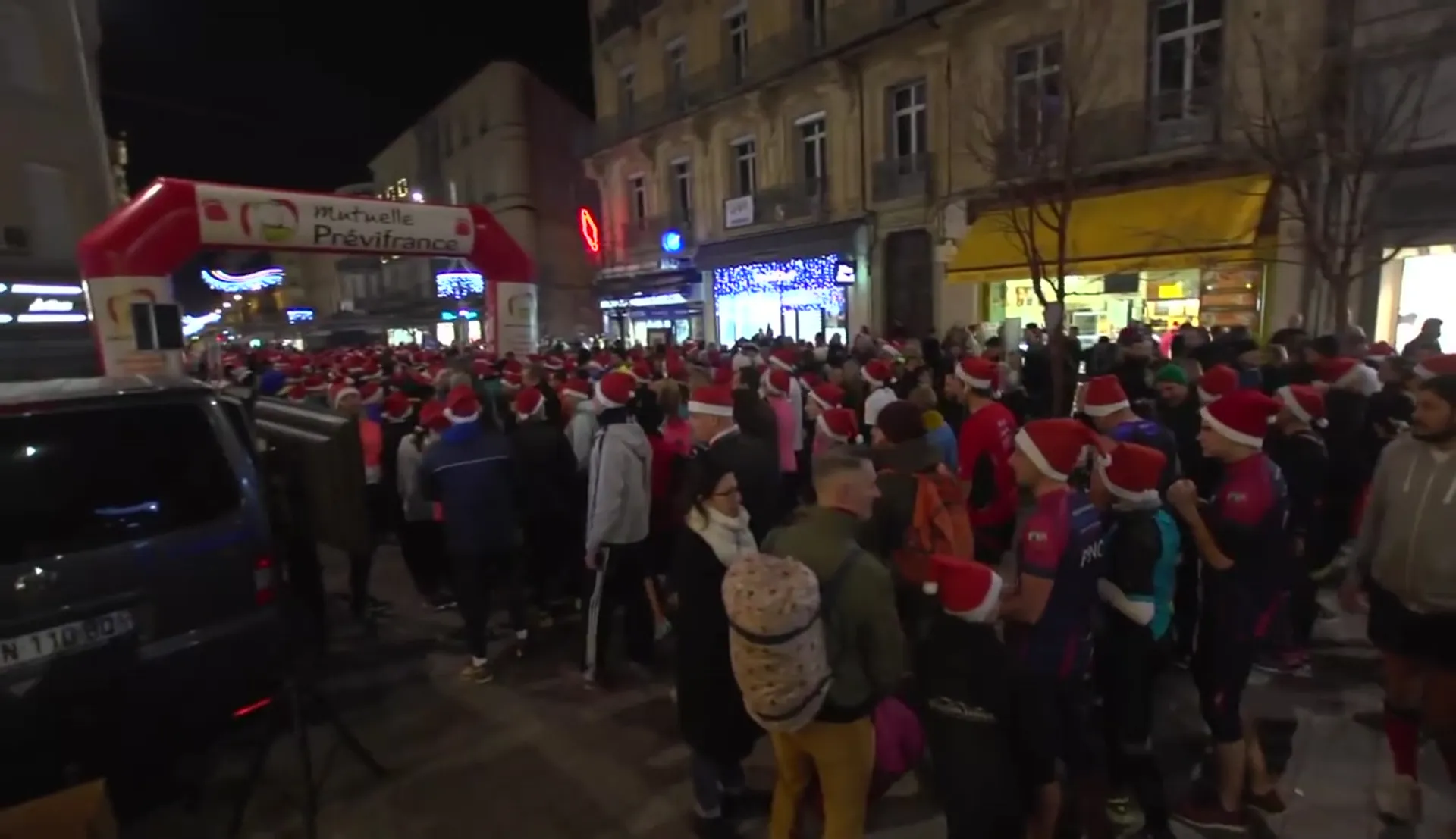 In this image, there appears to be a nighttime event where a large group of