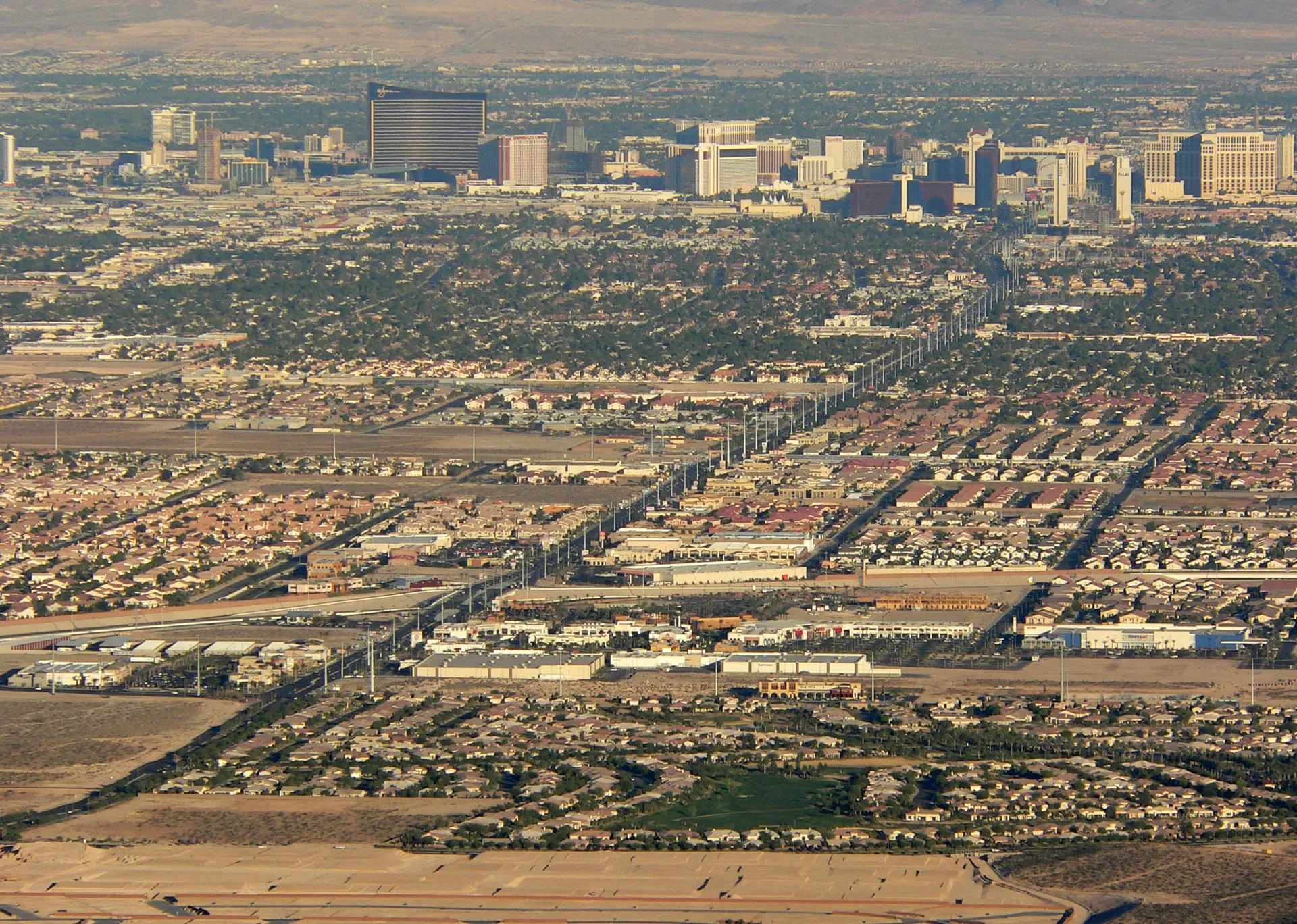 The image shows an aerial view of a sprawling urban area. From this perspective,