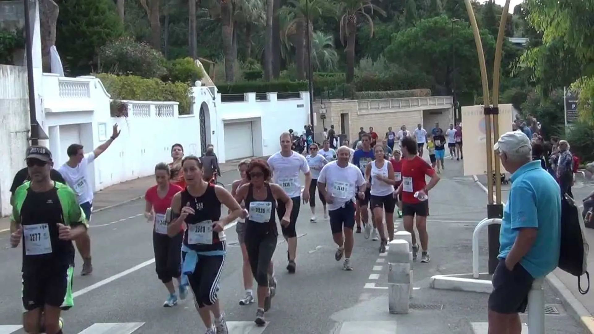 The image shows a group of people participating in a running event or race. They