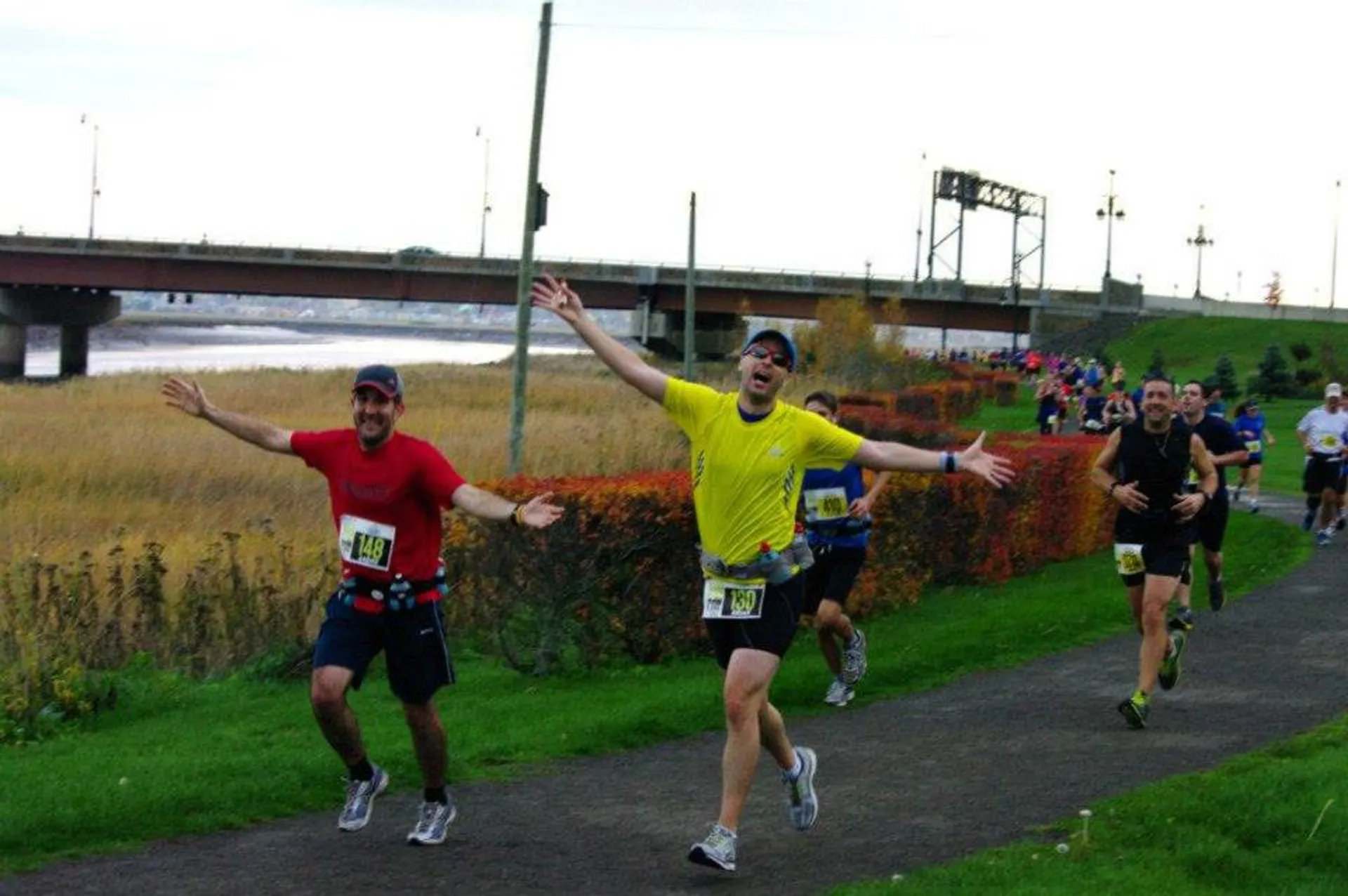 The image shows a group of runners participating in a race or a running event.