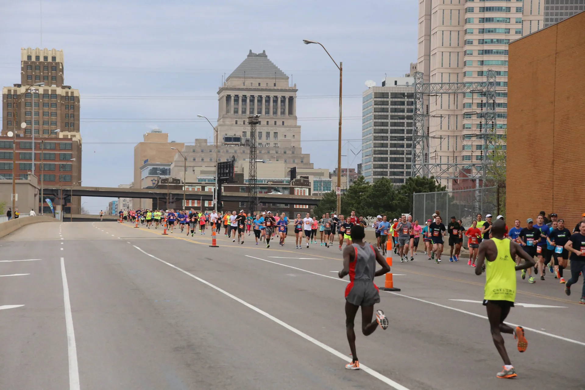 This image shows a group of runners participating in a road race, most likely a
