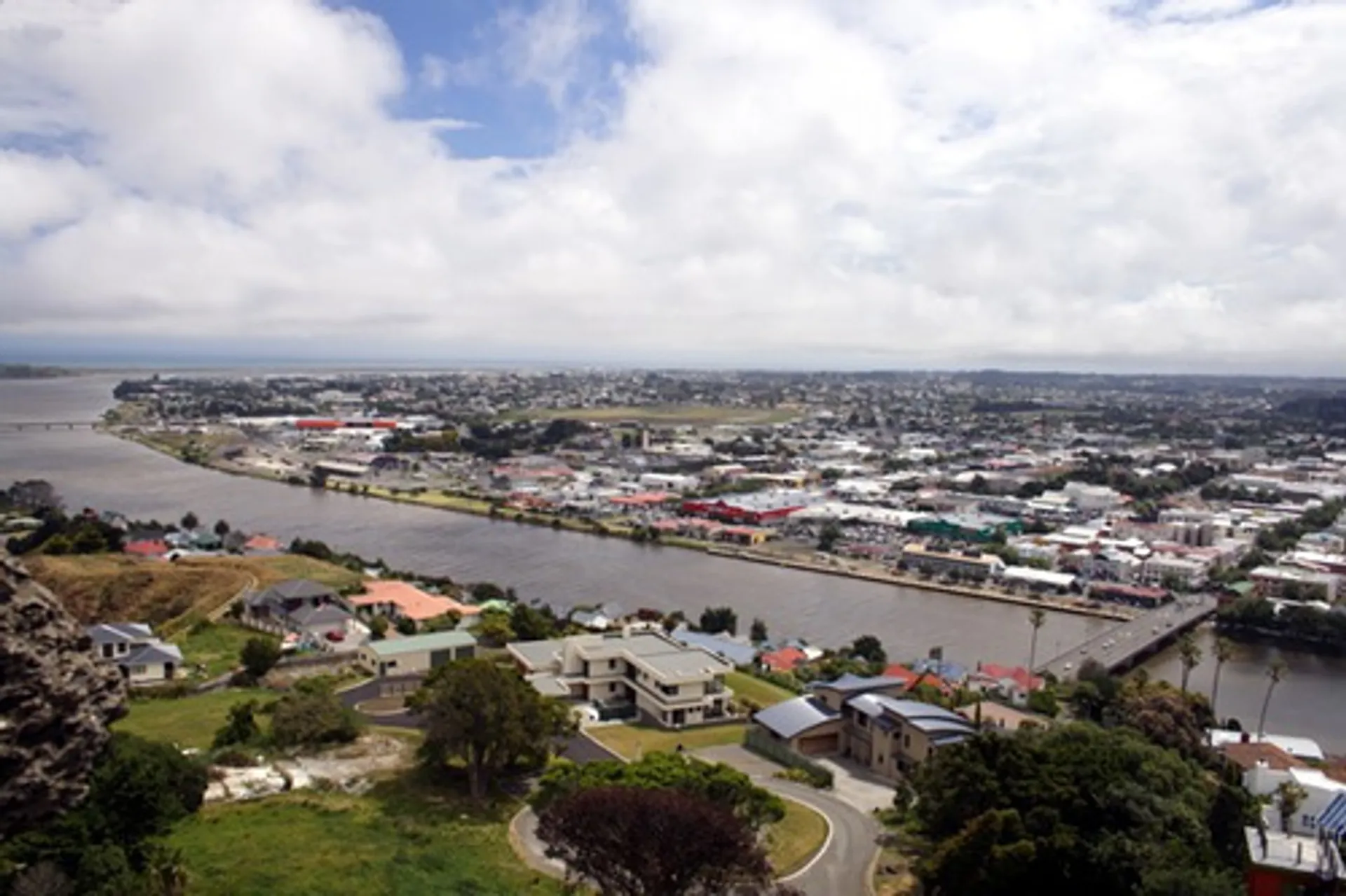 The image shows an aerial view of a town or city area with a river running