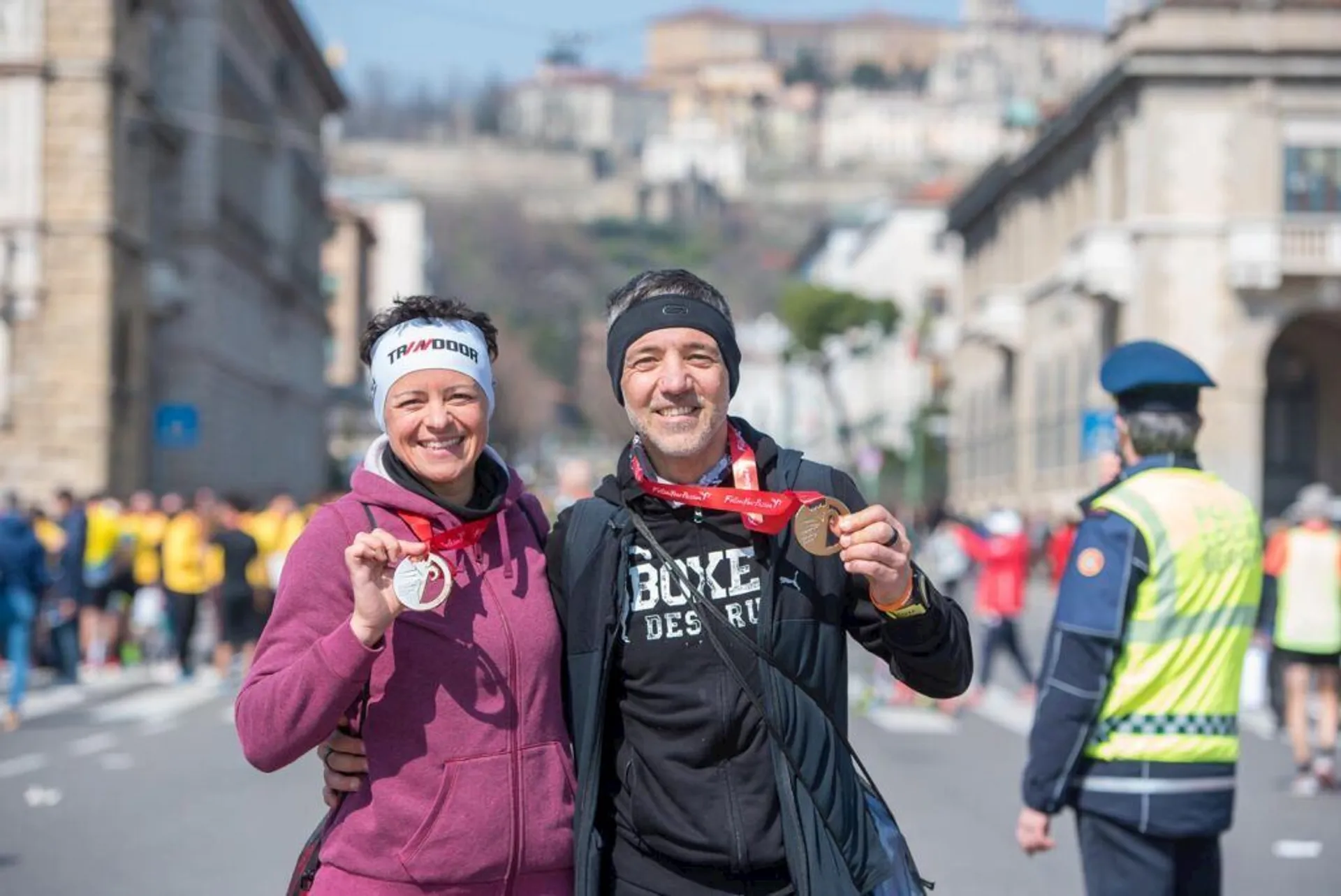 The image shows a man and woman who appear to be cheerful and celebrating, as