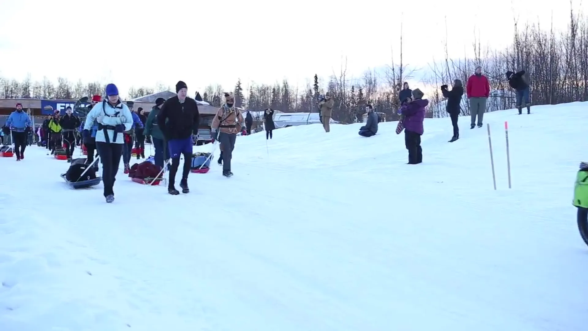 This image shows a group of people in a snowy environment, presumably at some kind