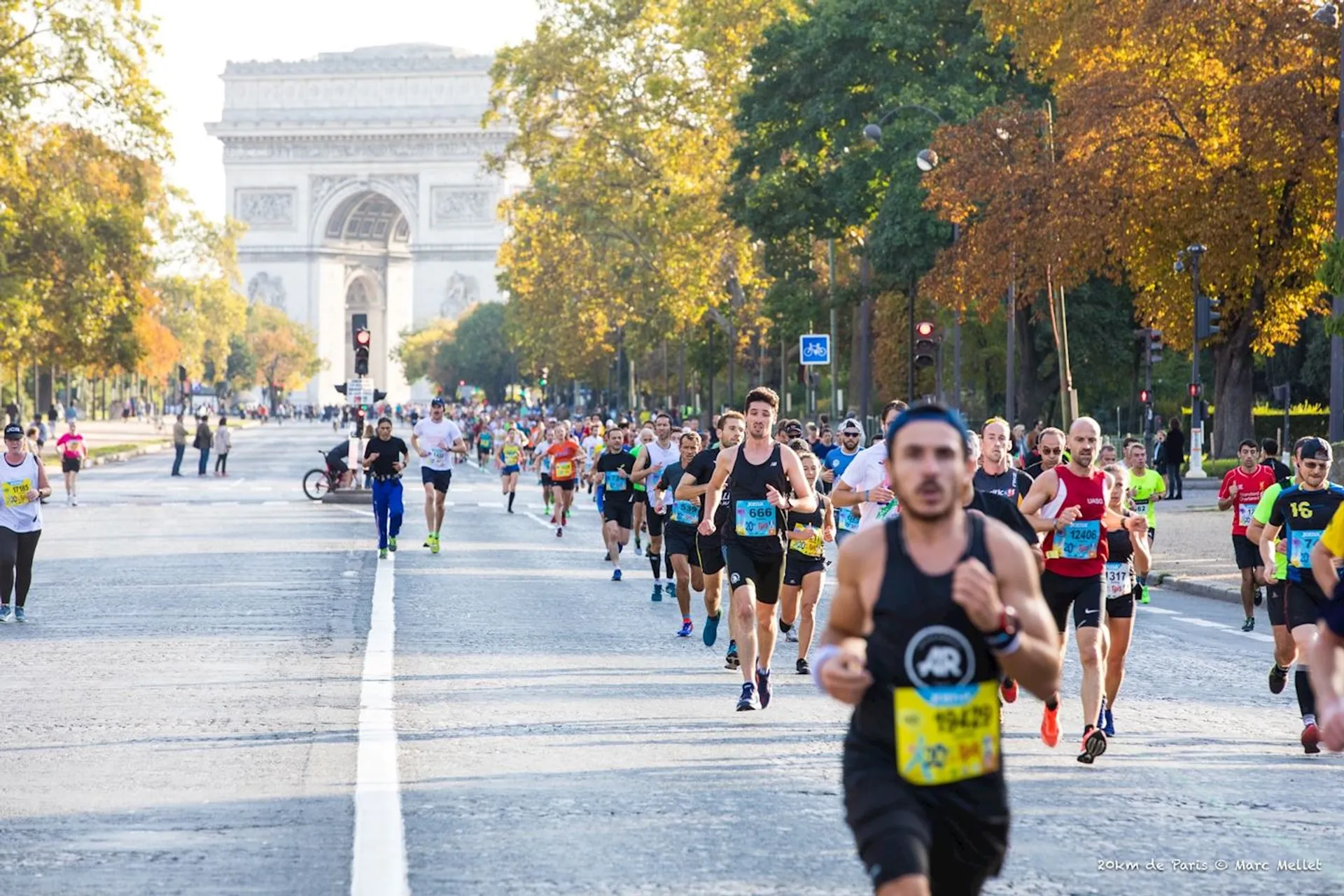 This is an image of a group of runners participating in a road race. They