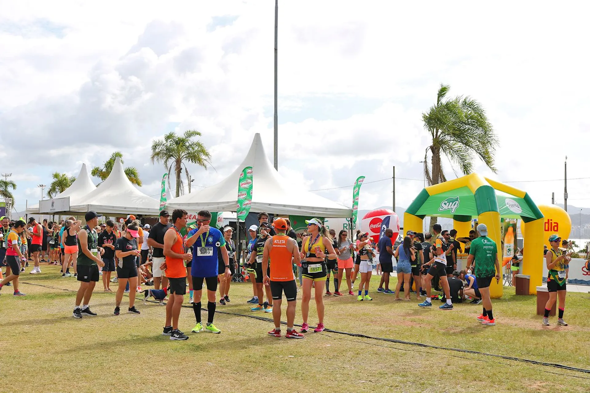 The image shows a group of people gathered outdoors at what appears to be a sporting
