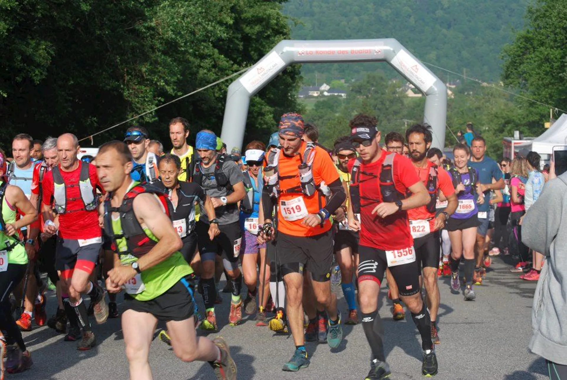 This image shows a group of runners at the start of a race. They are