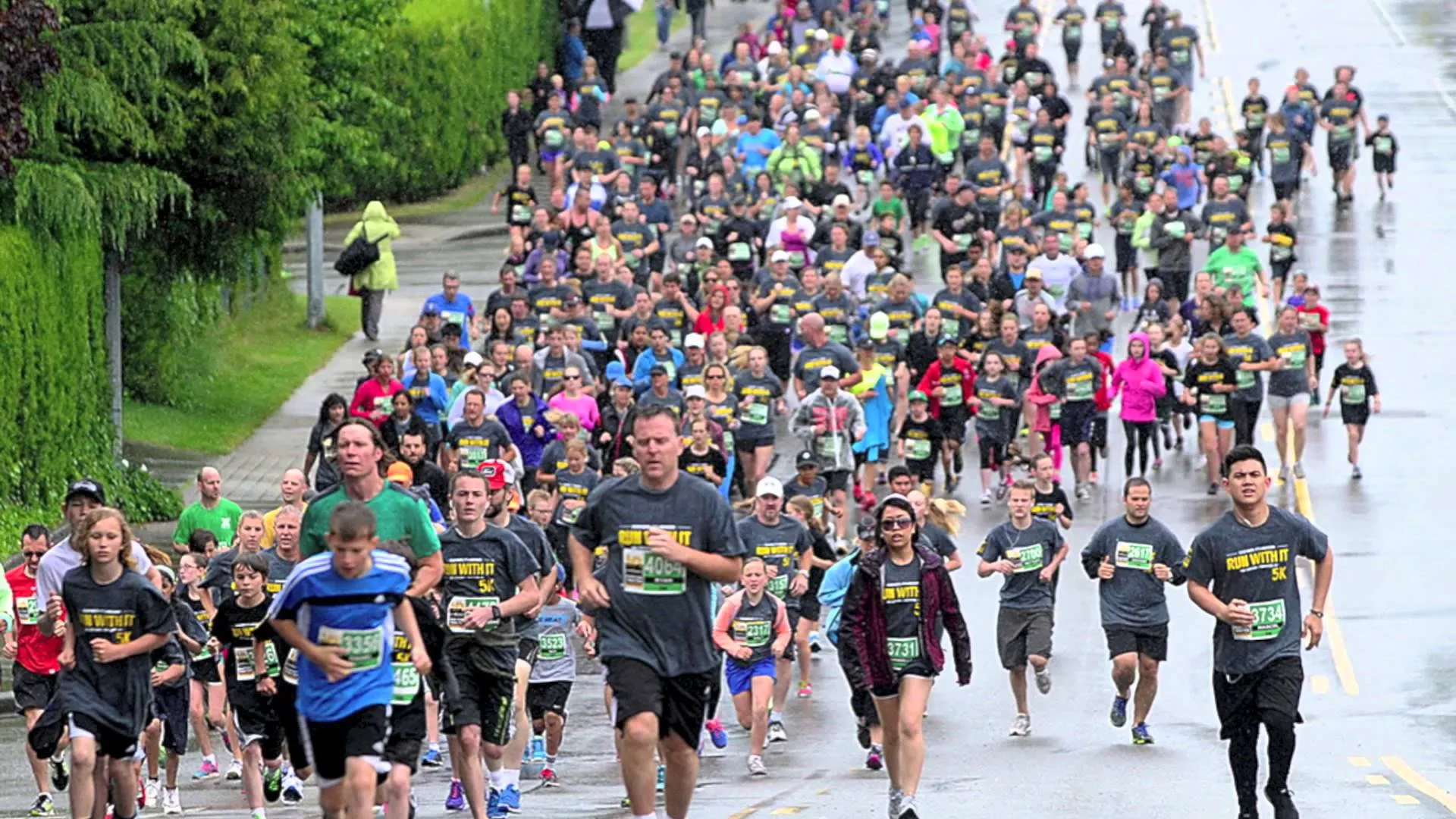 In this image, there's a large group of people participating in a running event