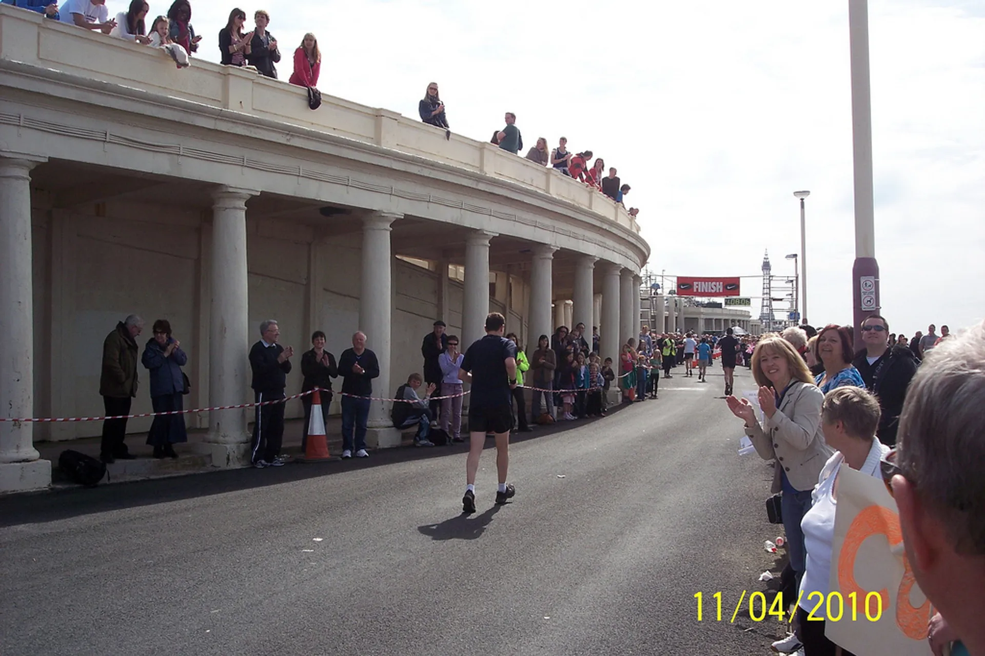 The image shows a running event that appears to be at or near its conclusion,