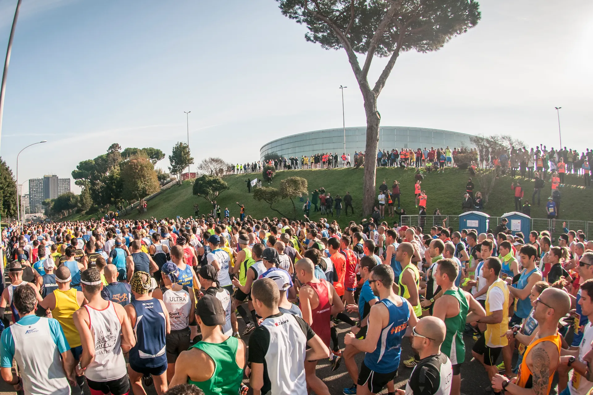 This image shows a large gathering of people, many of whom appear to be runners