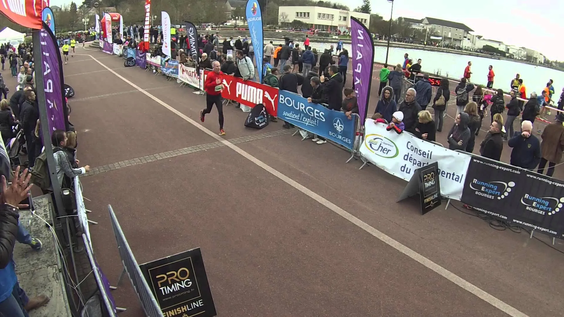 The image appears to show an outdoor event, possibly a marathon or race, based