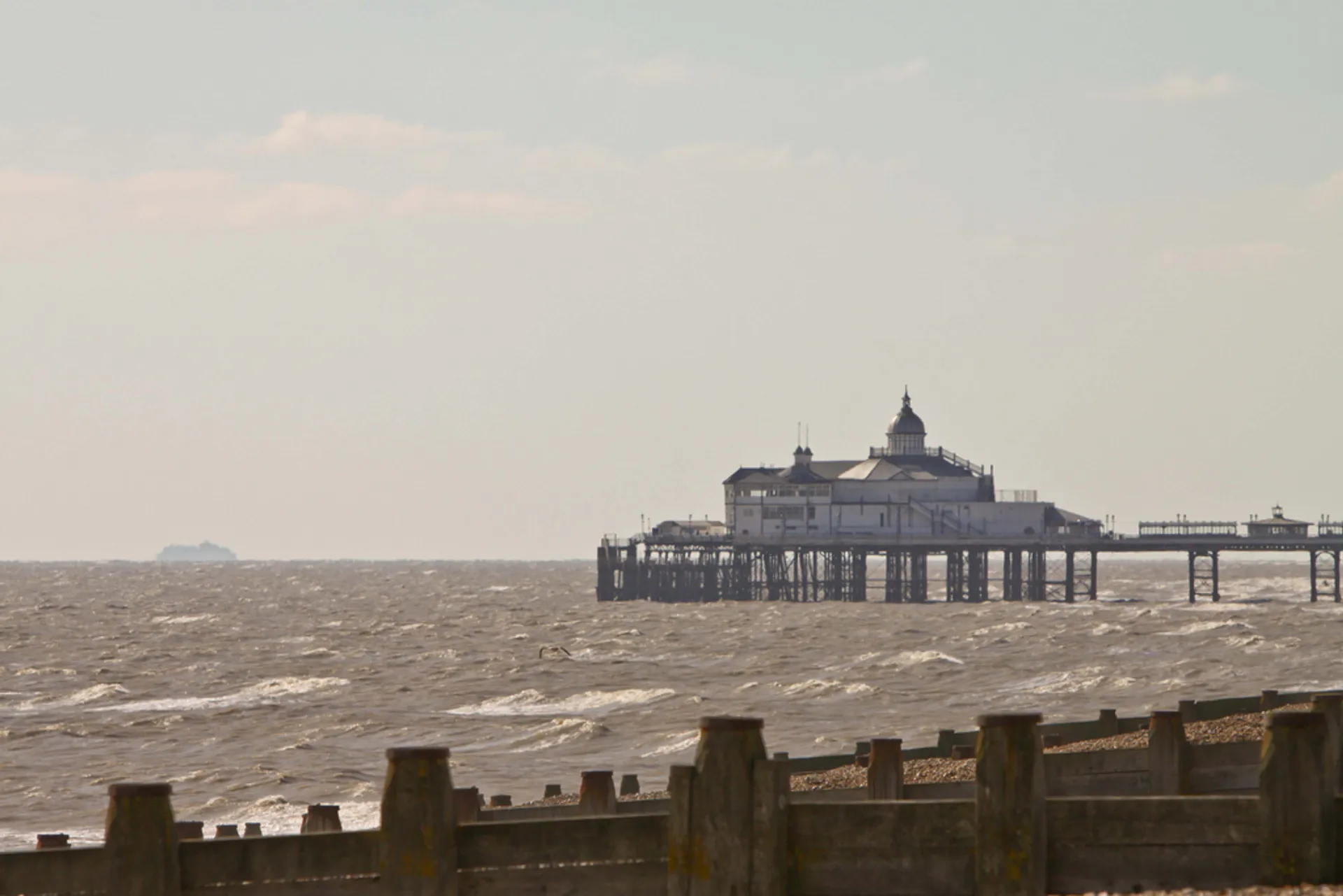 In this image, you can see a pier extending out into a body of water
