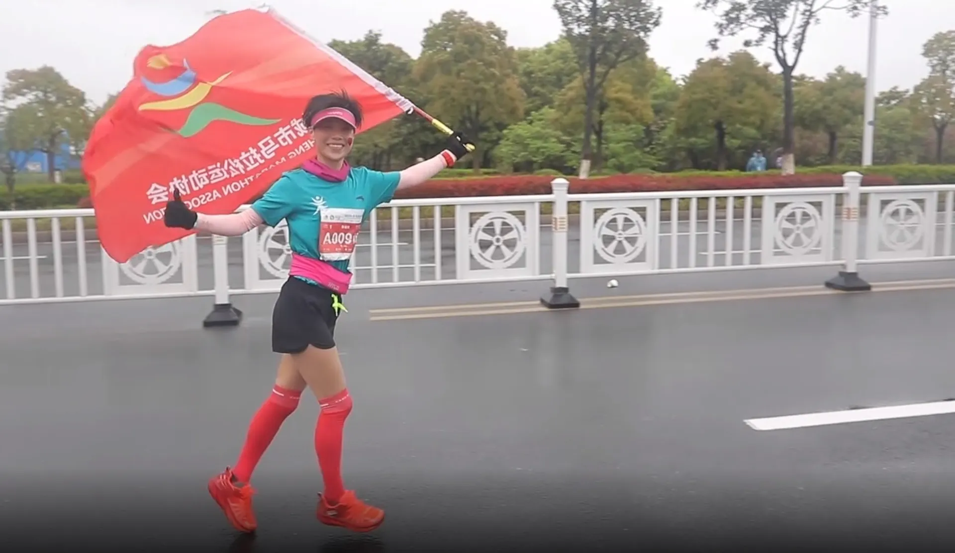 The image shows a person running on what appears to be a road or a bridge