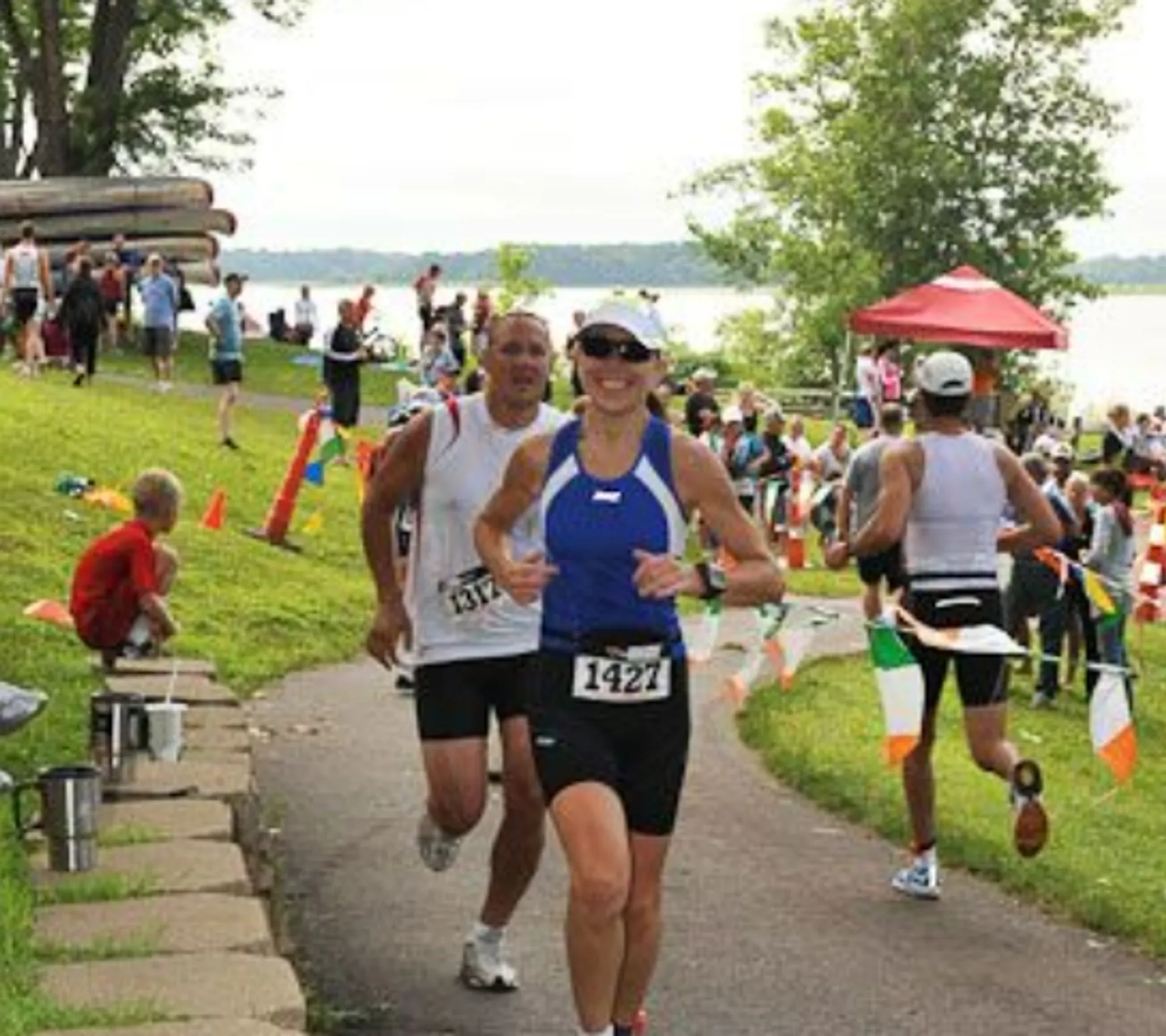 The image shows a group of people participating in what appears to be a running event