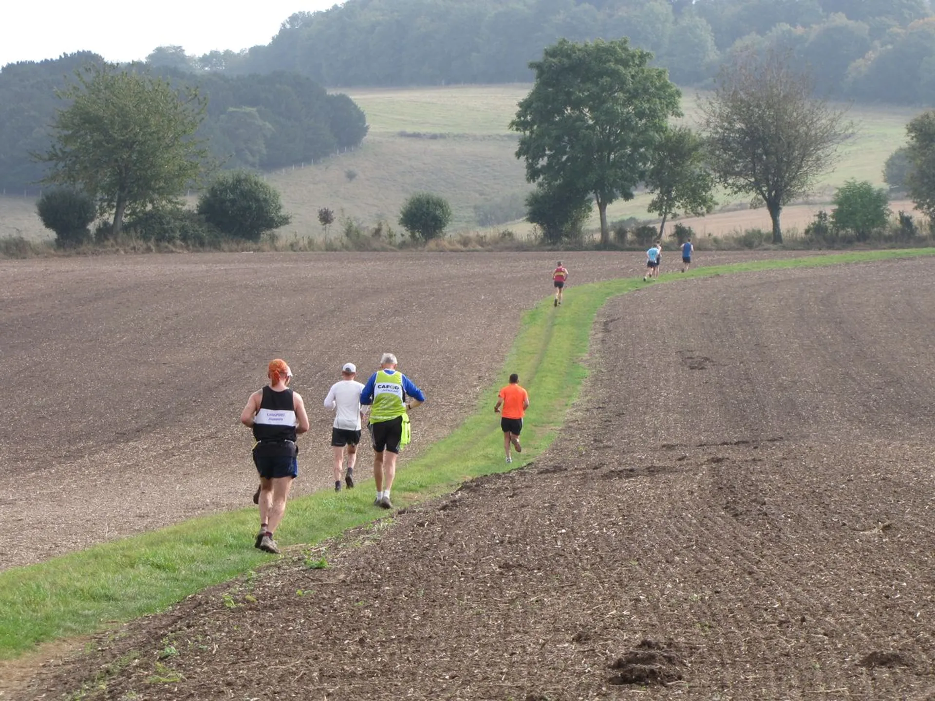 The image shows a group of people engaged in an outdoor activity, which appears to
