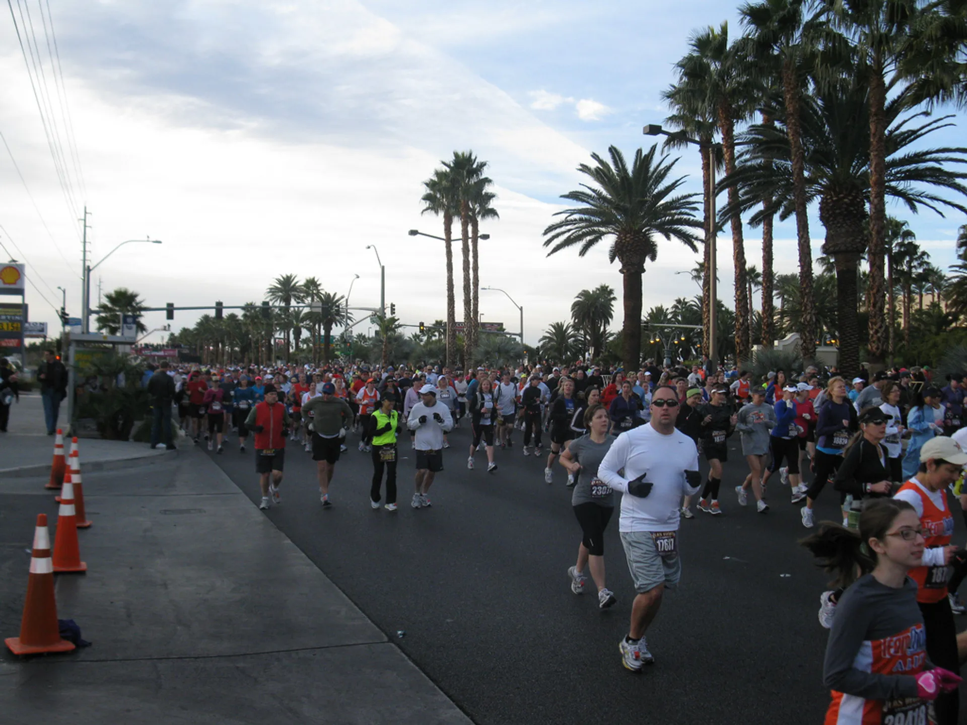 This image depicts a group of people participating in a running event. The participants are