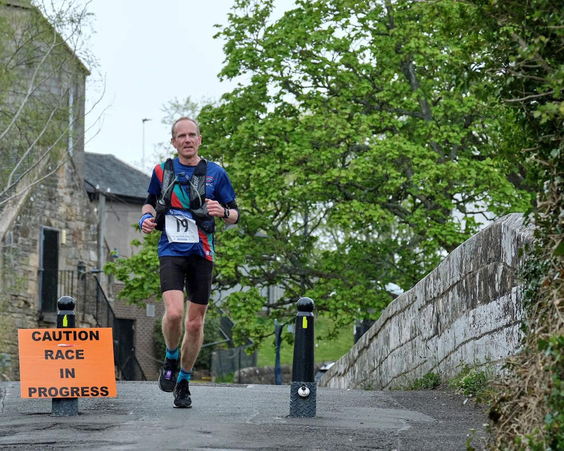 In the image, we see a person participating in a race, as indicated by