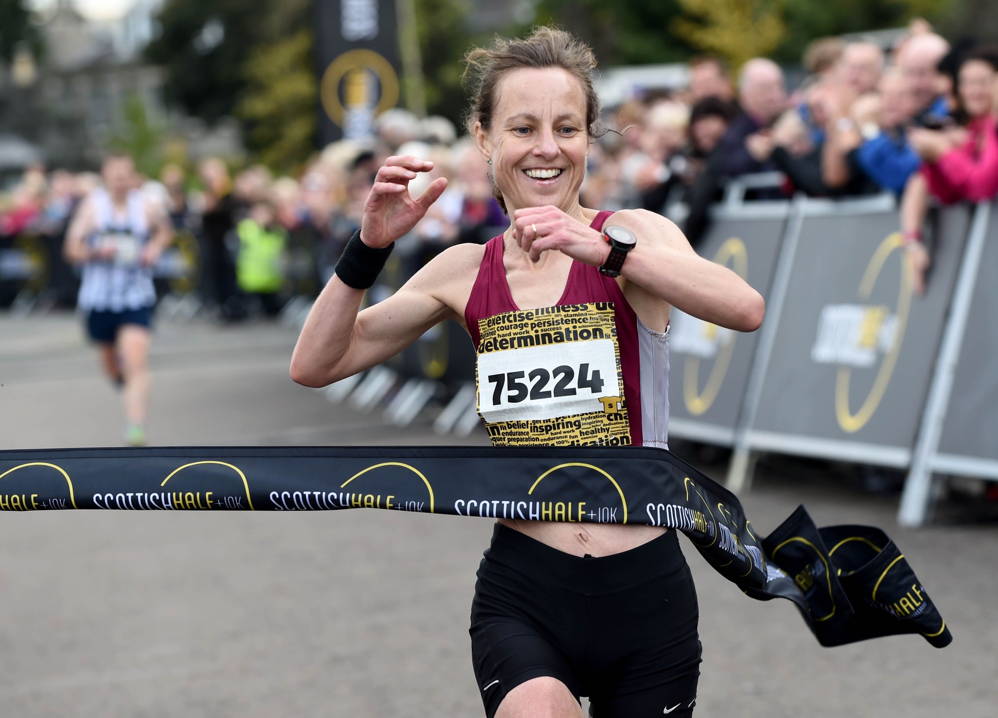 2017 Lisa Finaly breaks the tape to set a new Scottish Half Marathon course record