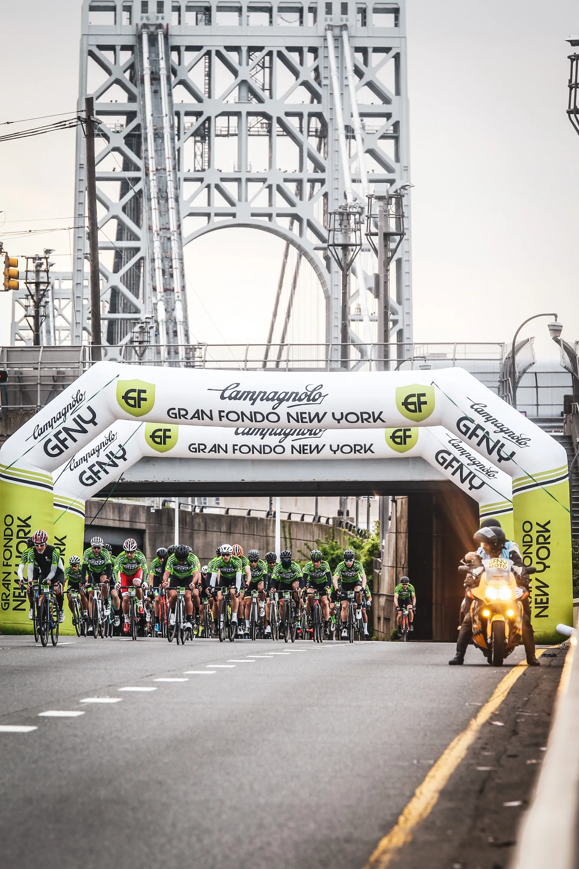 The image shows a cycling event, specifically the Gran Fondo New York. A