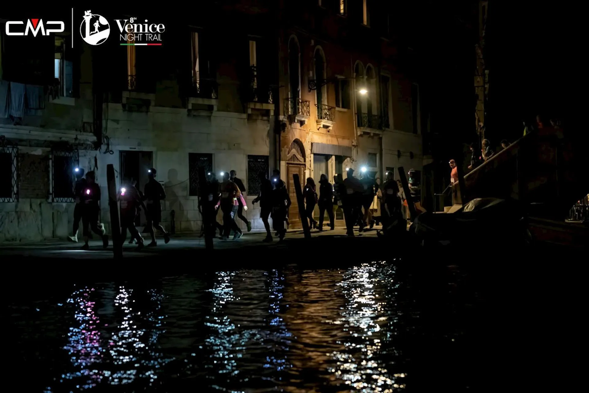 The image depicts a nighttime scene in which a group of people appear to be participating